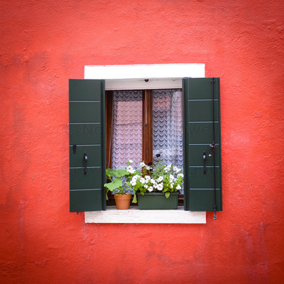 Burano window green shutters orange wall